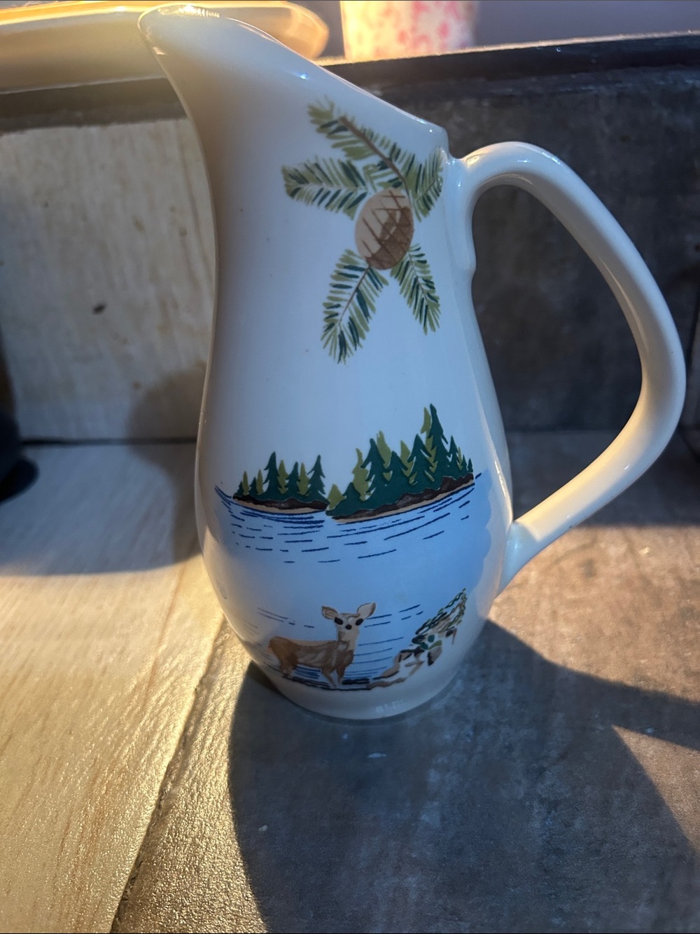White Ceramic Woodland Pitcher with Green and Brown Motif